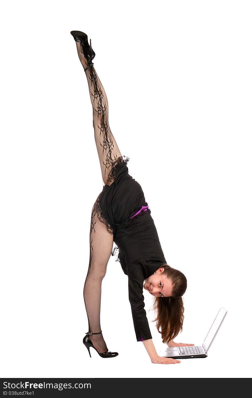 Girl in black suit bends forward to notebook.