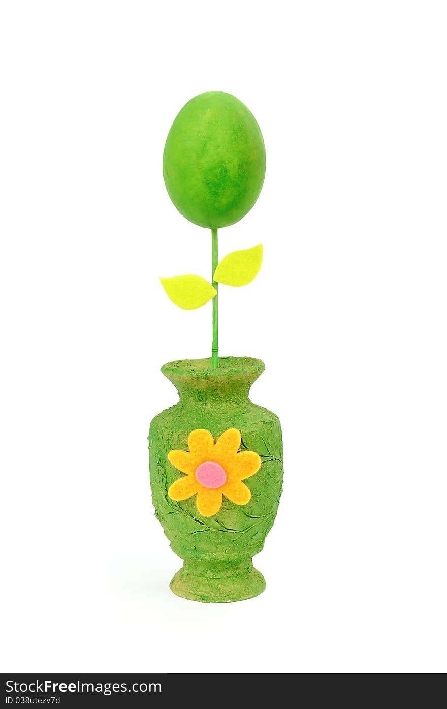 Colourful Easter egg in a green vase