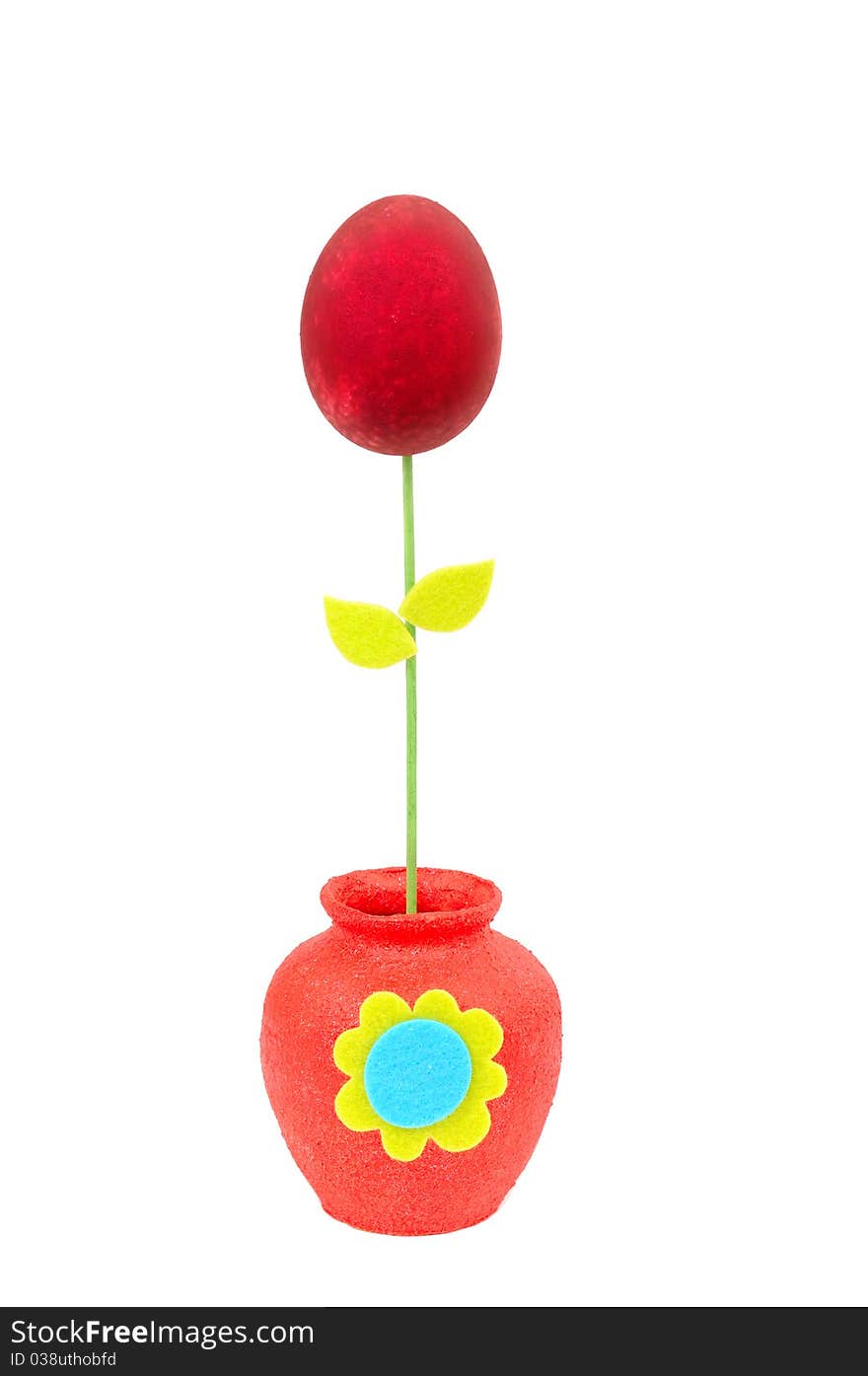 Colourful Easter egg in a red vase. Isolated on the white