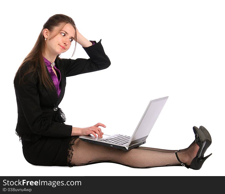 Girl in black suit sits on floor with notebook and thinks. Isolated on white. Girl in black suit sits on floor with notebook and thinks. Isolated on white.