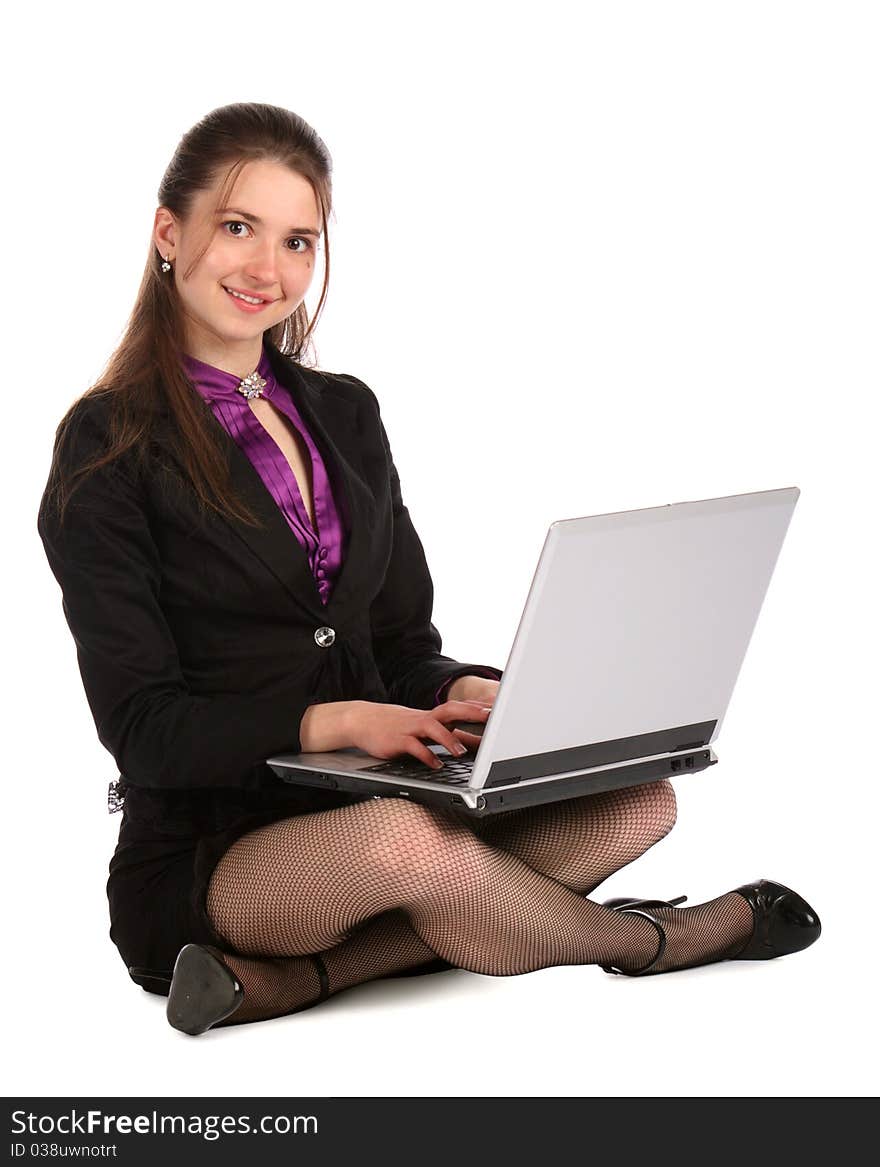 Girl in black suit with notebook working. Isolated on white.