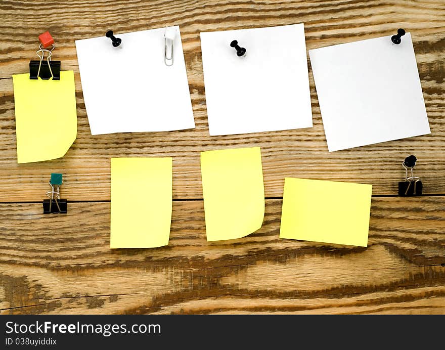 Wooden board with announcements and writing buttons