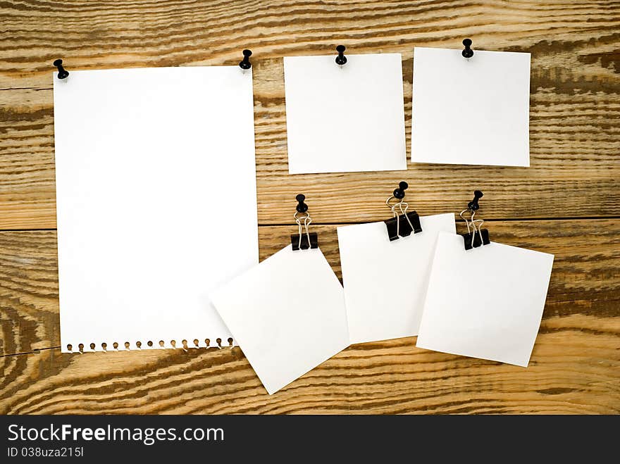 Wooden board with announcements and writing buttons