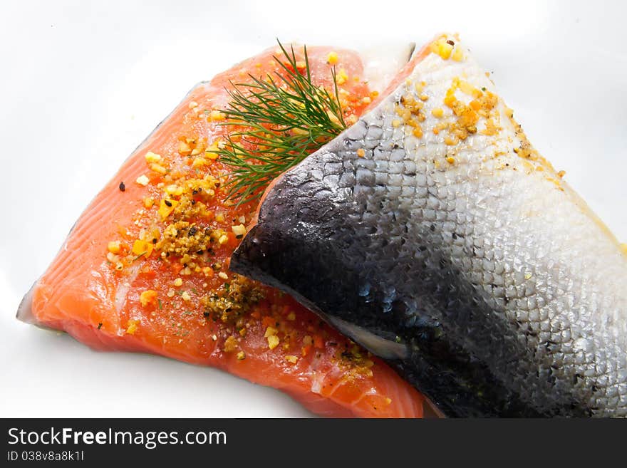 Raw isolated salmon with herbs