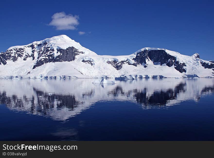 Mountains in Antarctica reflected in water. Mountains in Antarctica reflected in water