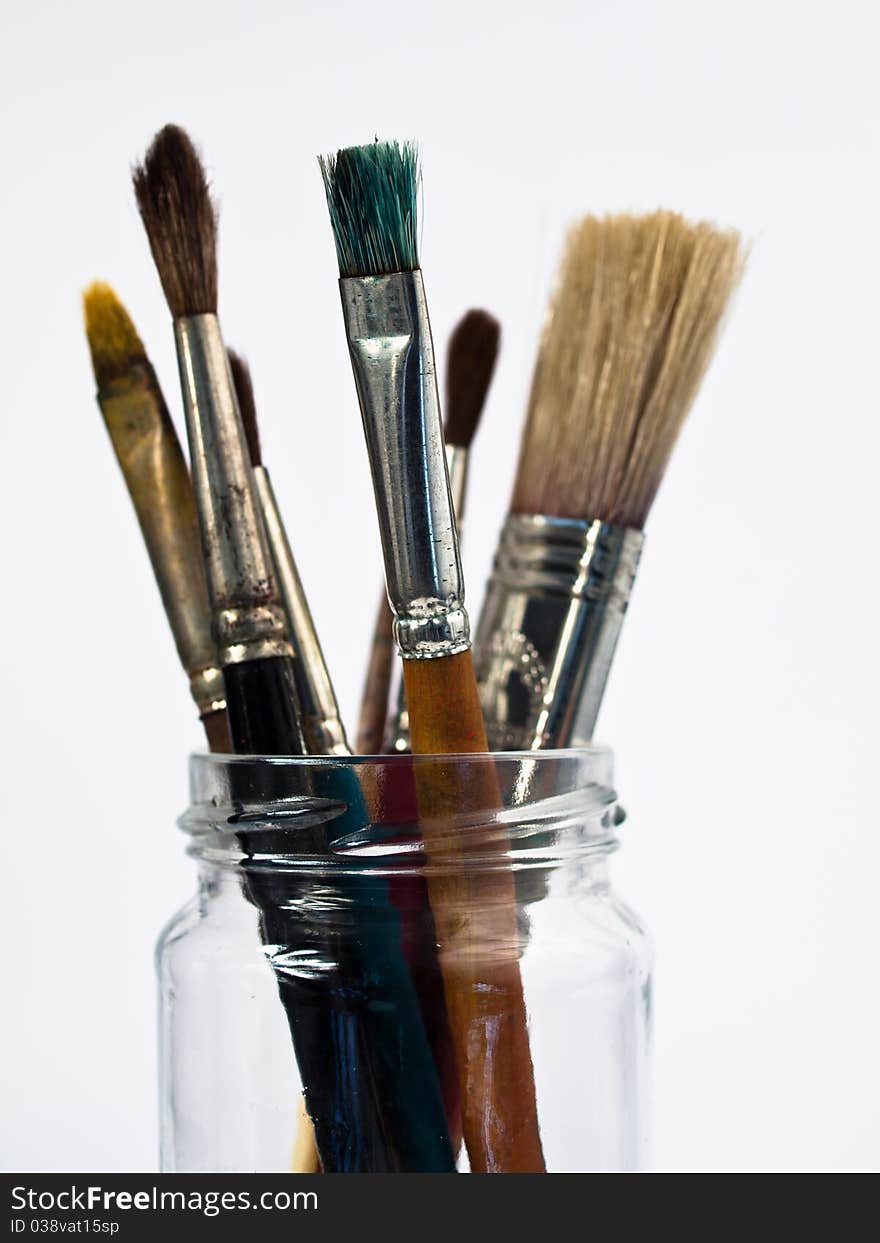 Paintbrushes in a Glass isolated on white background