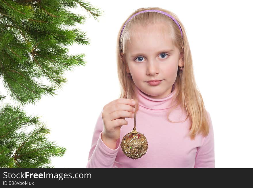 Pretty girl with a christmas ball isolated on white