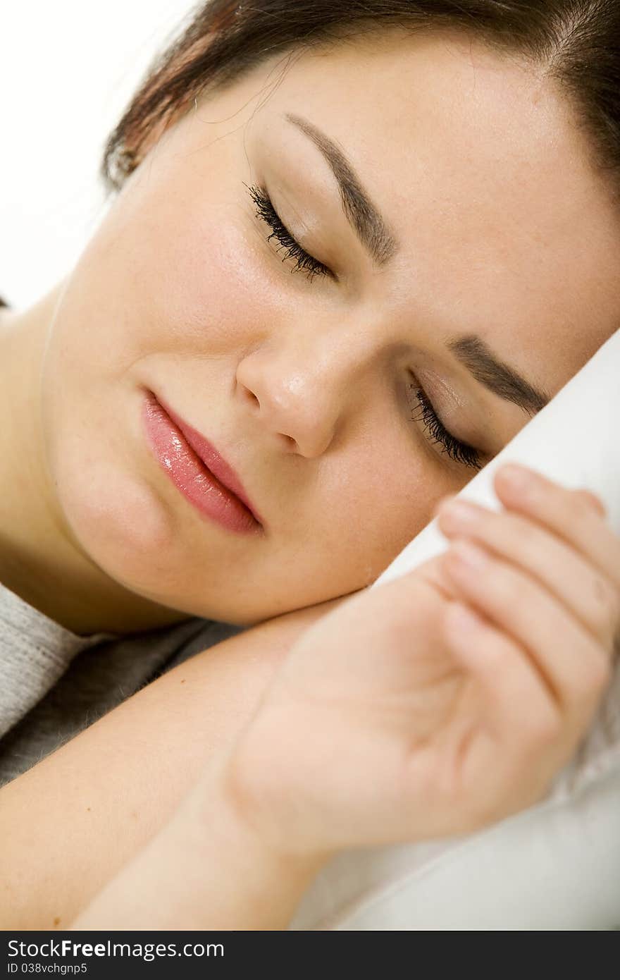 Woman laying down, relaxing in her bed