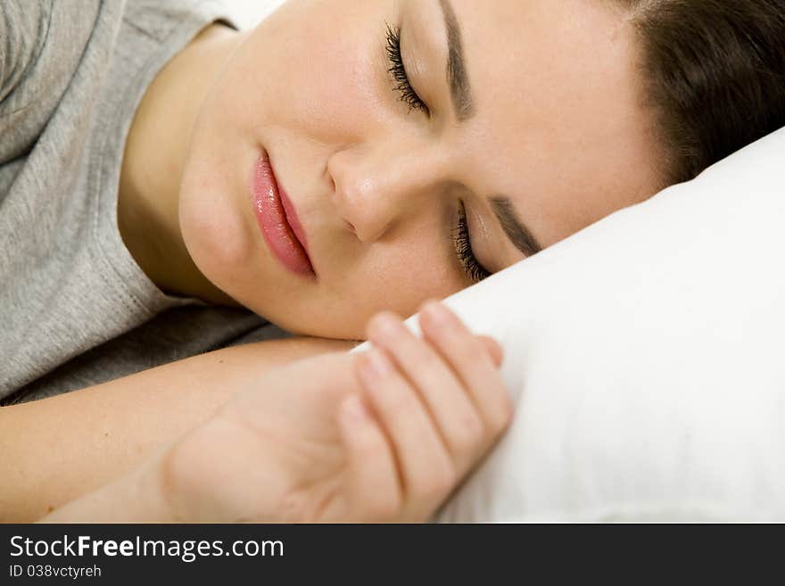 Woman laying down, relaxing in her bed