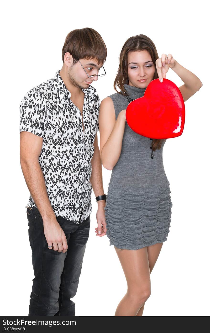 Funny nerd guy gives a valentine glamorous girl isolated on white