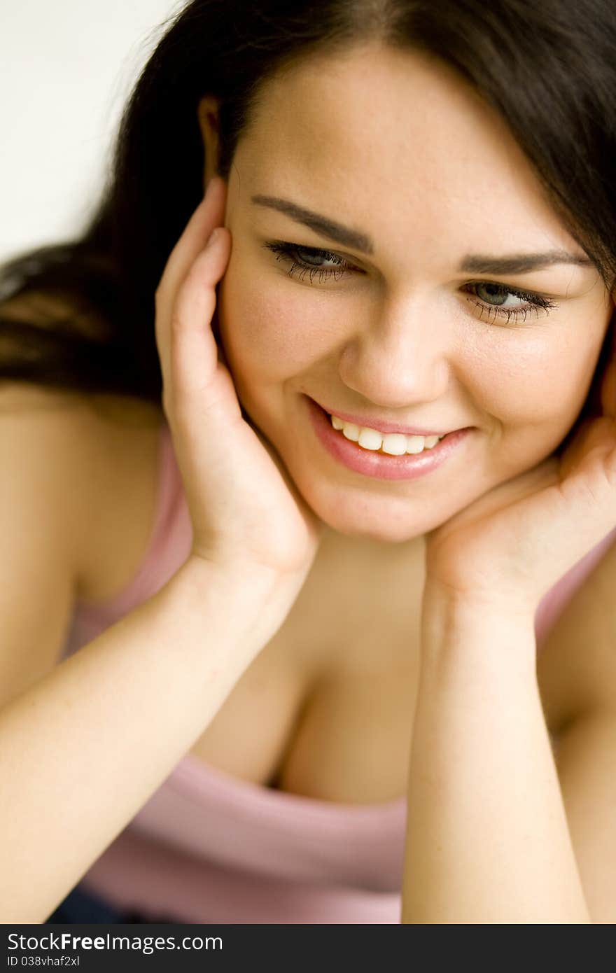 Young pretty woman's portrait on the white background