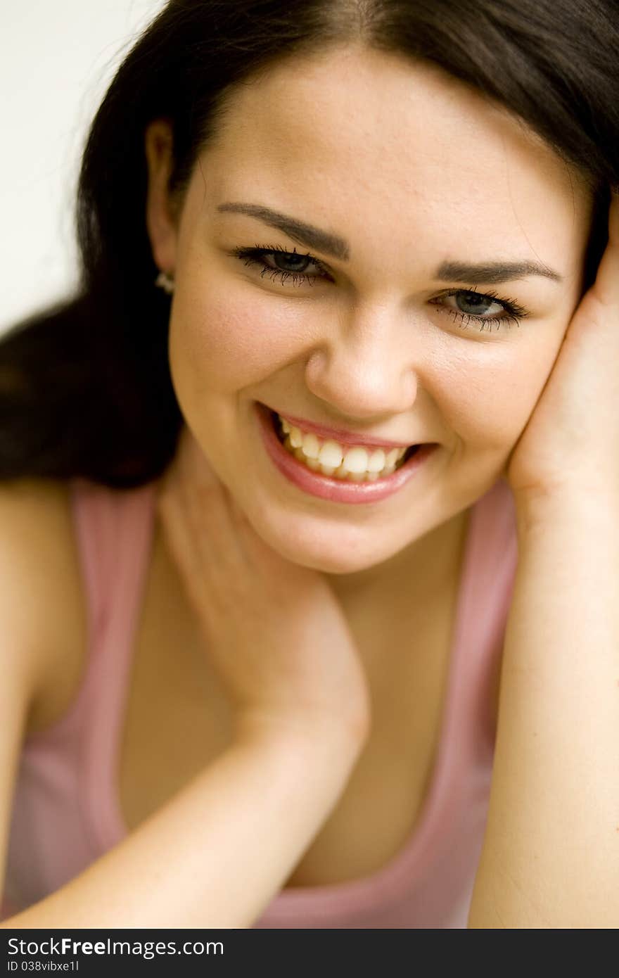 Young pretty woman's portrait on the white background