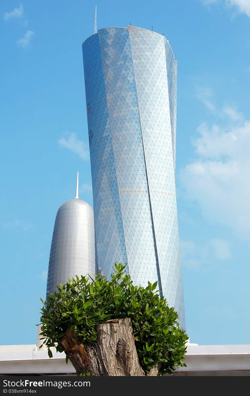 Beautiful blue glass Skyscraper and tree