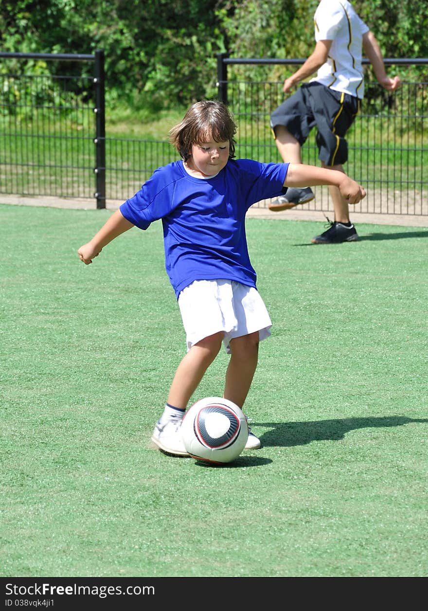 Young boy shooting ball