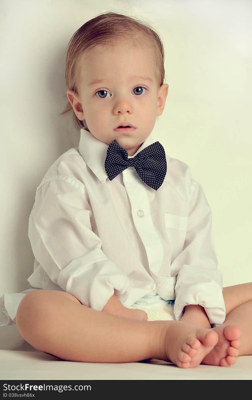 Cute little boy in a white shirt