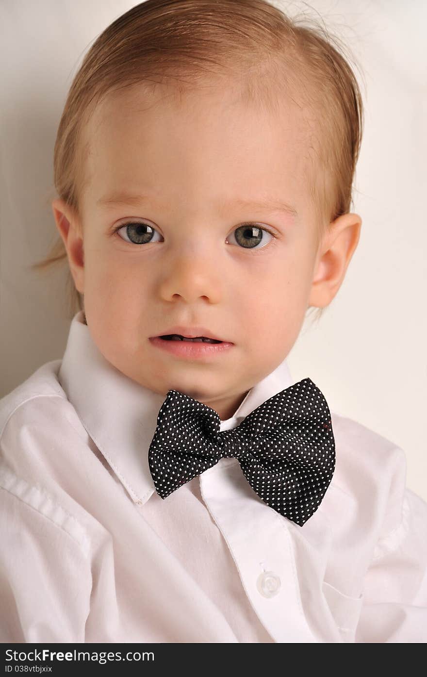 Cute little boy in a white shirt