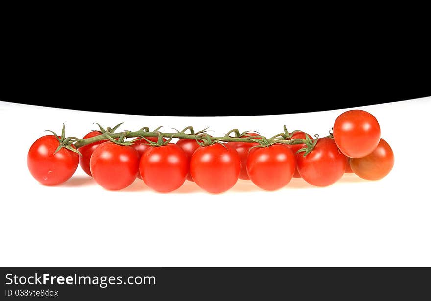 Cherry tomato --is a smaller garden variety of tomato, on a white and black background