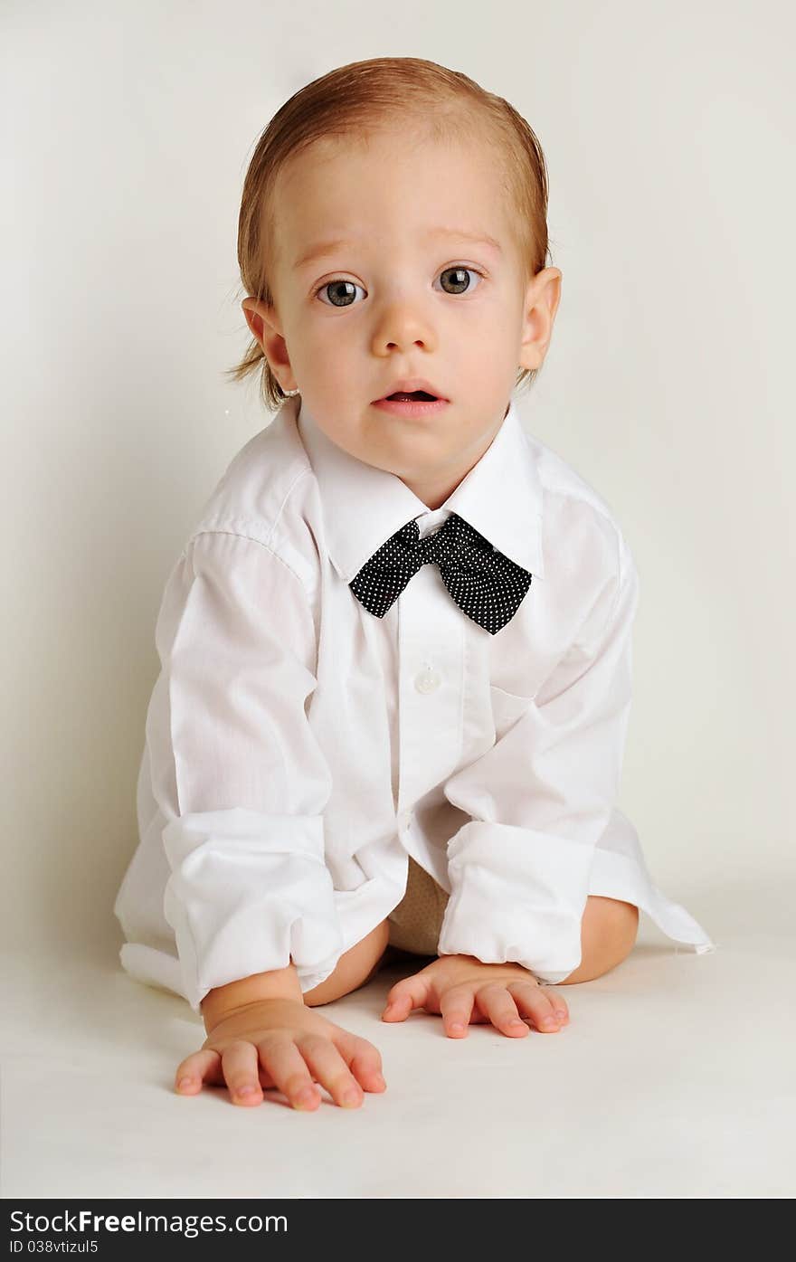 Cute little boy in a white shirt