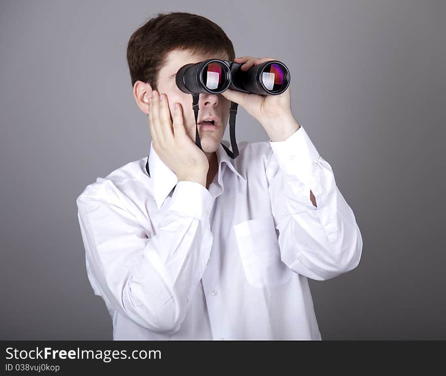 Young businessmen in t-shirt with black binocular