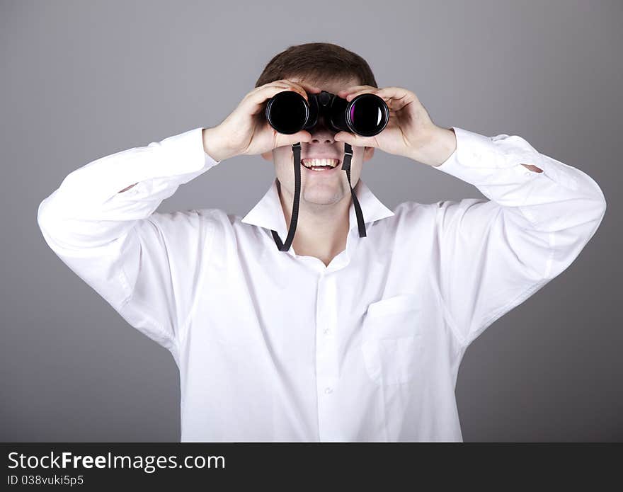 Young businessmen in t-shirt with black binocular