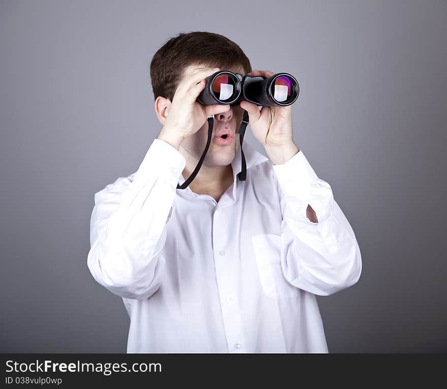 Young businessmen in t-shirt with black binocular