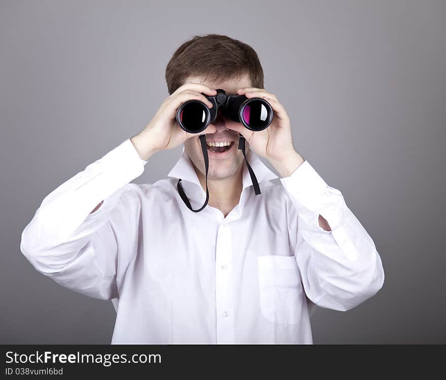 Young businessmen in t-shirt with black binocular