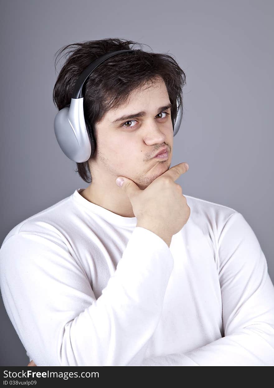 Young doubt men with headphone. Studio shot.