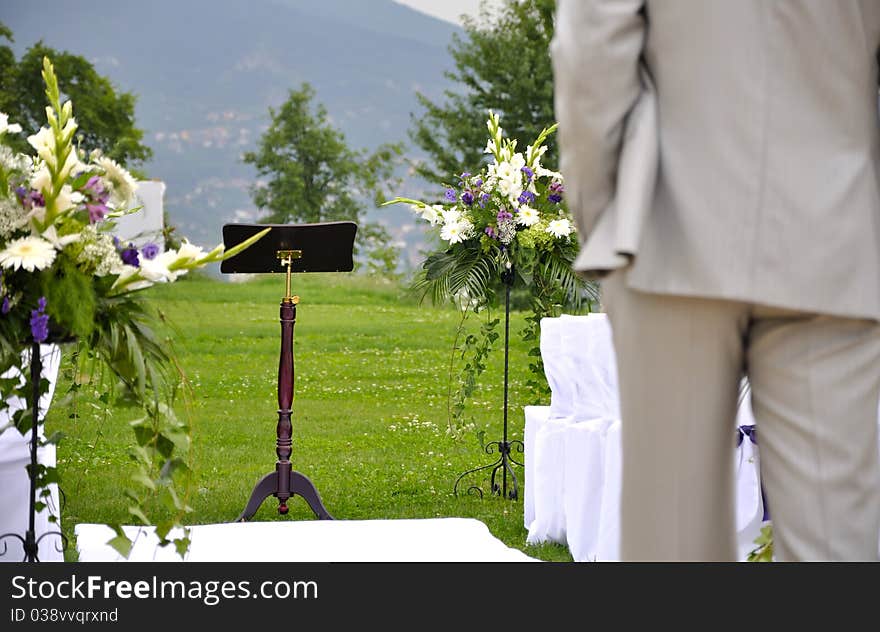 Man standing in front of wedding altar in nature