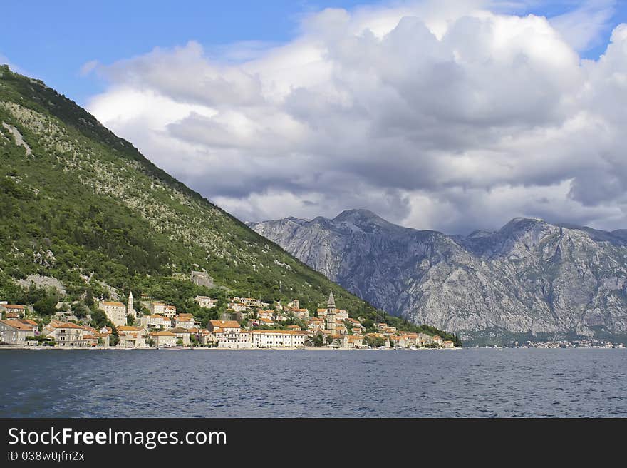 Old town at the foot of the mountains near the sea. Old town at the foot of the mountains near the sea