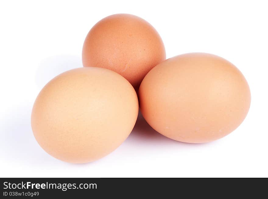 Three hen's eggs laying on white. Three hen's eggs laying on white