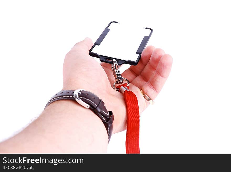 Badge in a hand on a white background