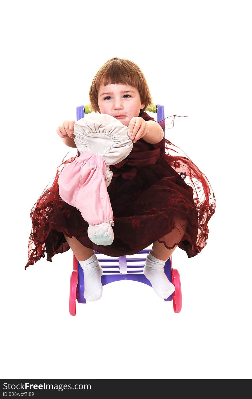 A sweet little girl, three years old, in a nice burgundy dress having fun with her stuffed animal, for white background. A sweet little girl, three years old, in a nice burgundy dress having fun with her stuffed animal, for white background.