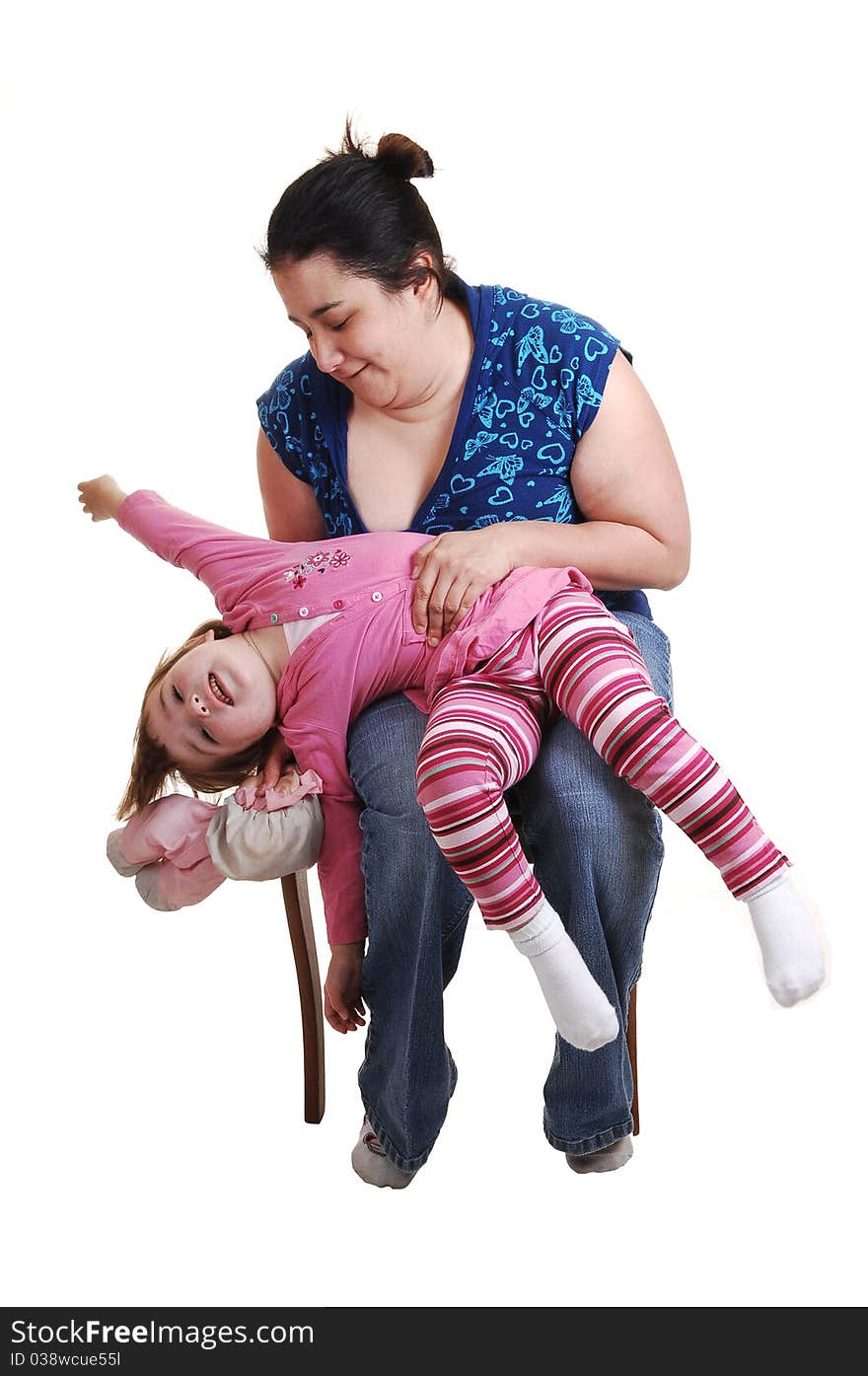 Mother and daughter having fun in the studio, for white background. Mother and daughter having fun in the studio, for white background.