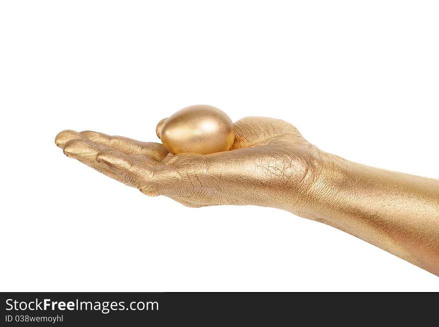 Gold egg in a gold man s hand