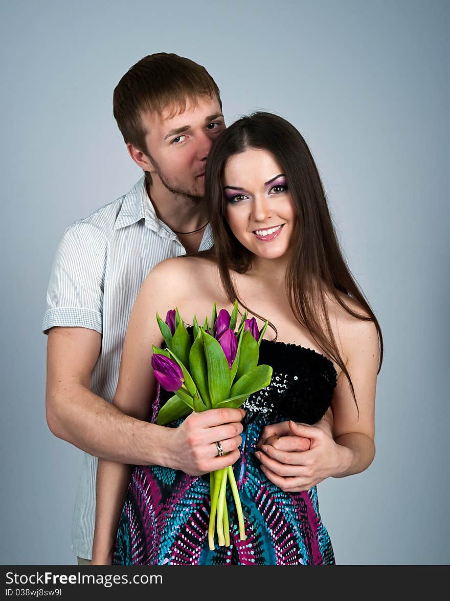 Young couple over blue background