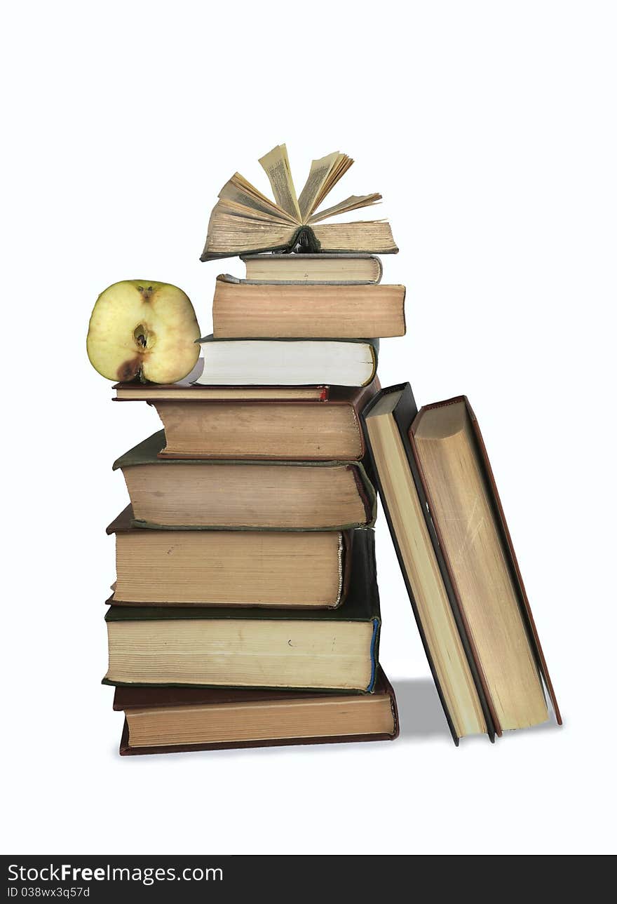 A Stack Of Old Books And Sliced Apple