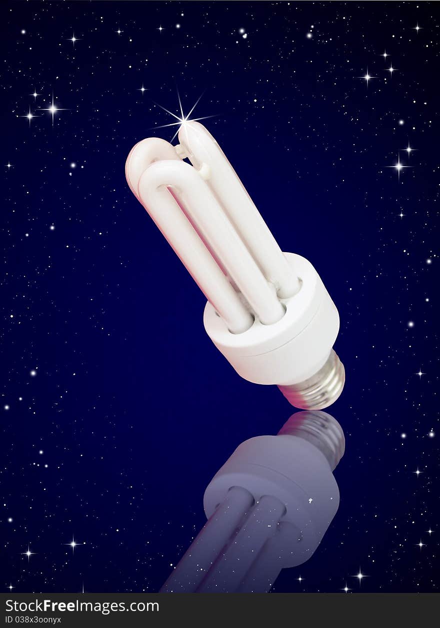 Isolated compact florescent light bulb on night sky background