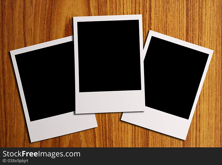 Blank photos on a wood background illustration