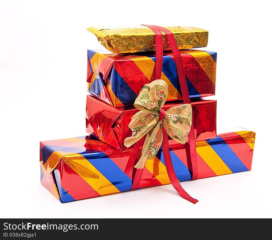 Stack of gift boxes with bow on white