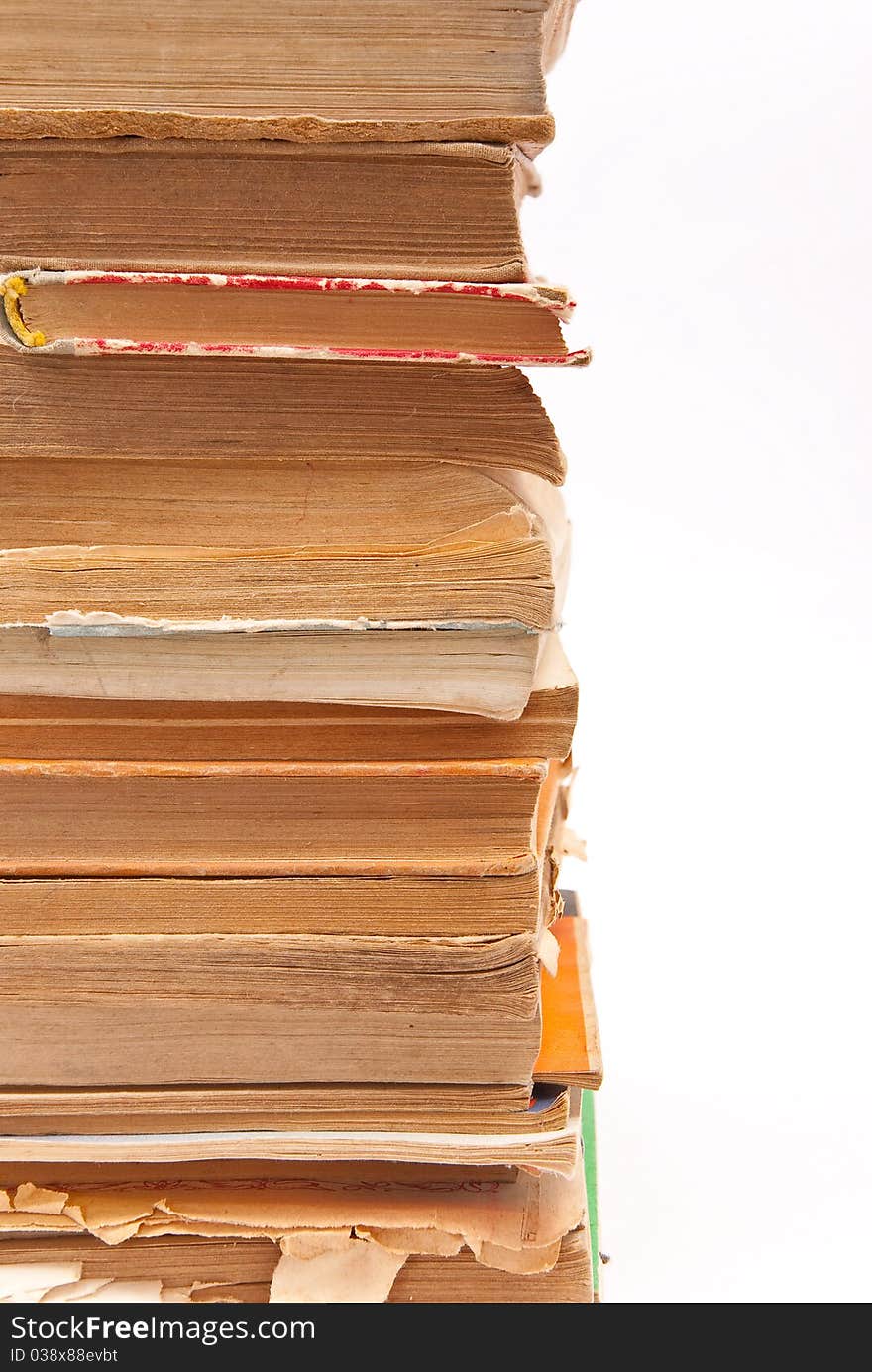 Pile of old books on white