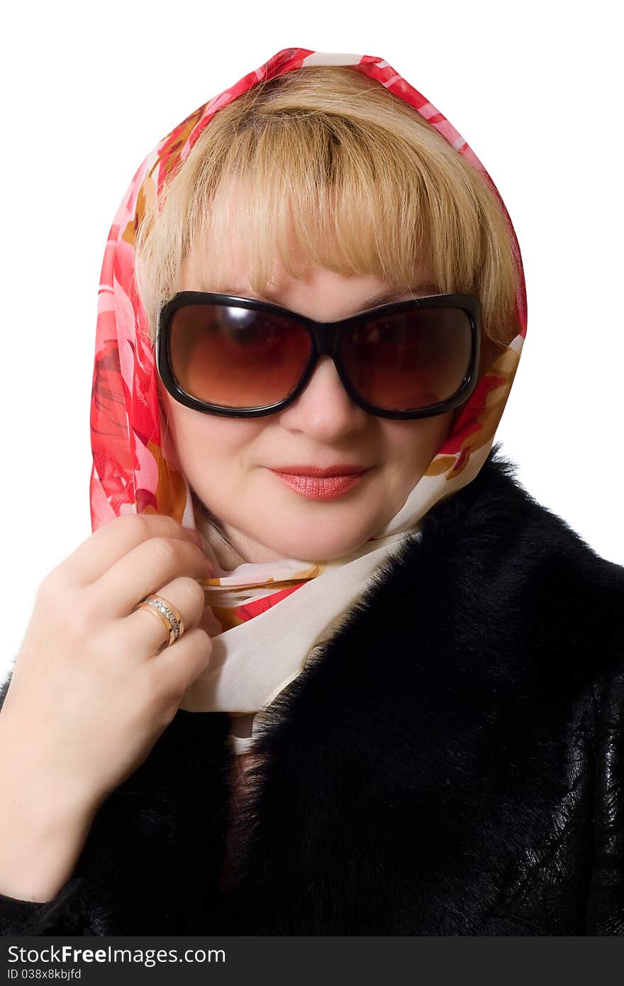 Attactive matture woman in sunglasses and kerchief on head isolated over white