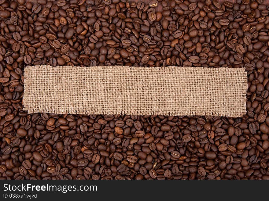 Burlap tag on the background of coffee