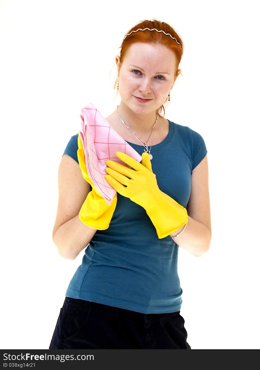 Redhead young woman holding a rag in housewife role