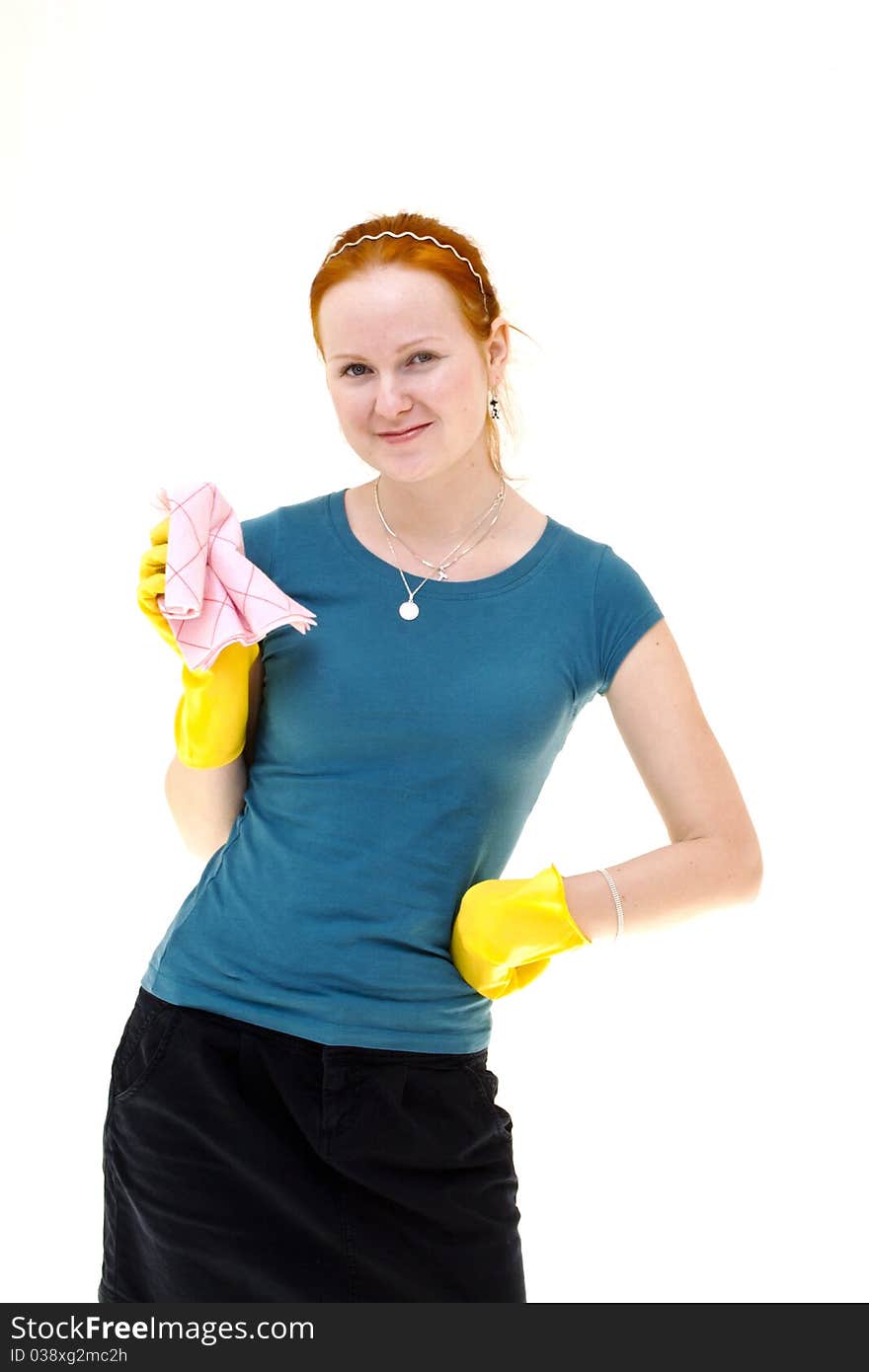 Redhead young woman holding a rag in housewife role