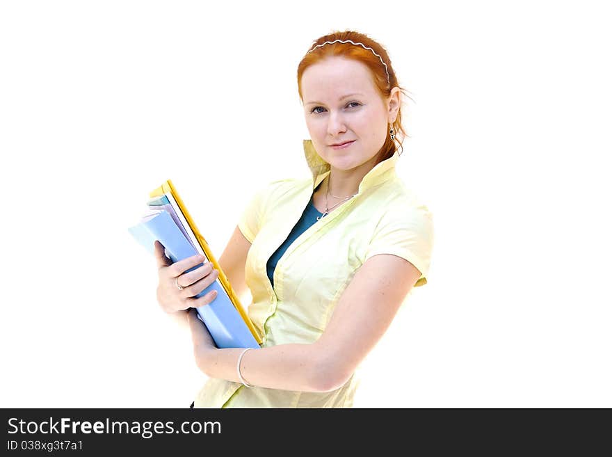 Redhead young woman student holding a notebooks