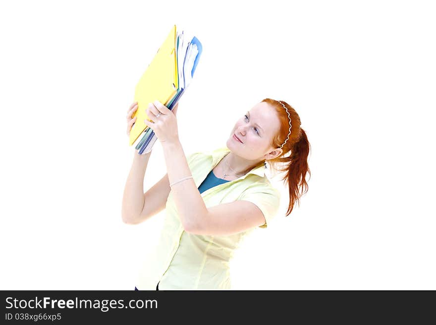 Redhead young woman student holding a notebooks isolated