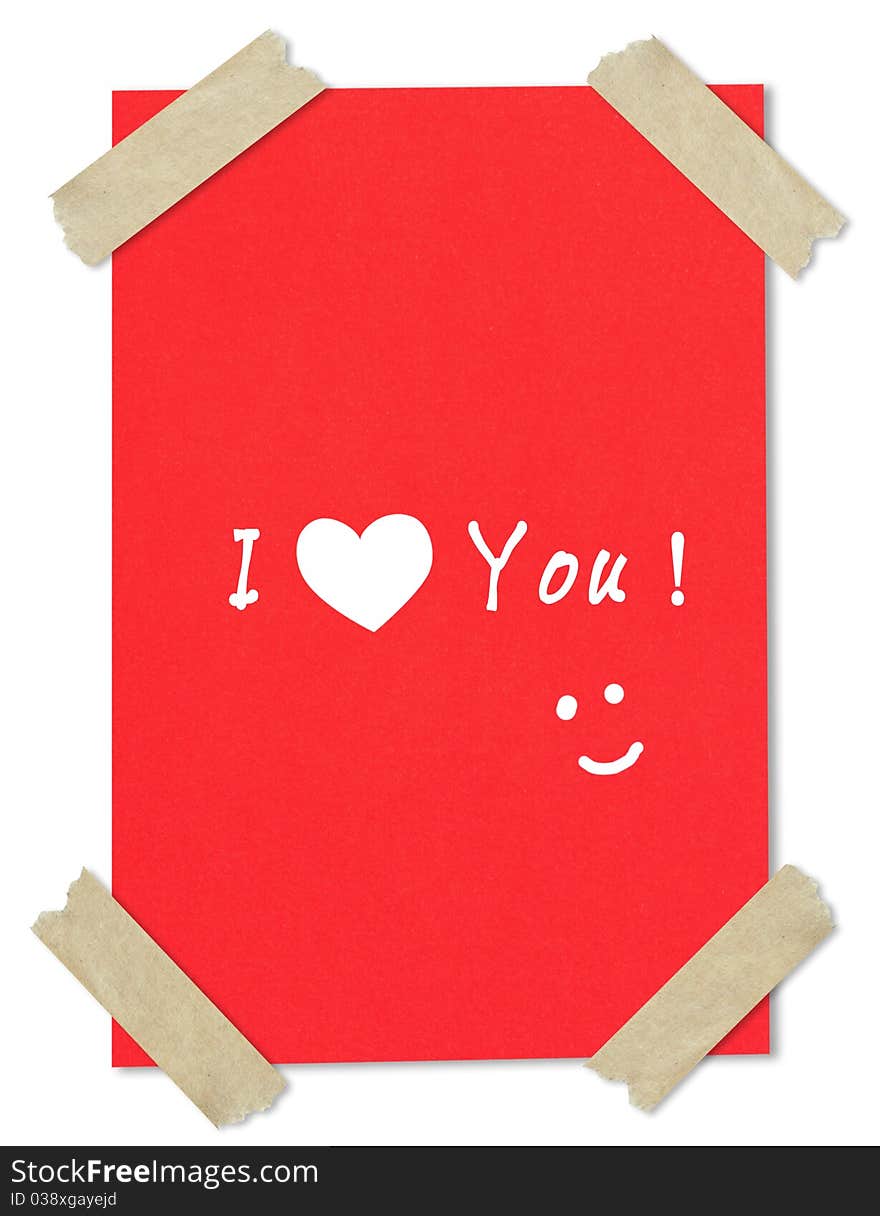 MessageI love you writing on red paper stuck with brown tape. MessageI love you writing on red paper stuck with brown tape