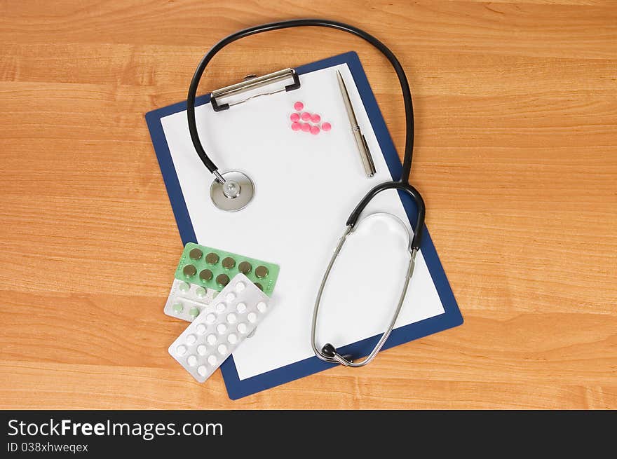 Blank clipboard with modern stethoscope still life