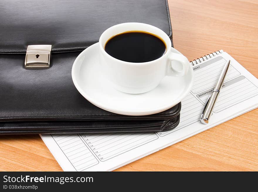 Black Portfolio And Coffee On A Table