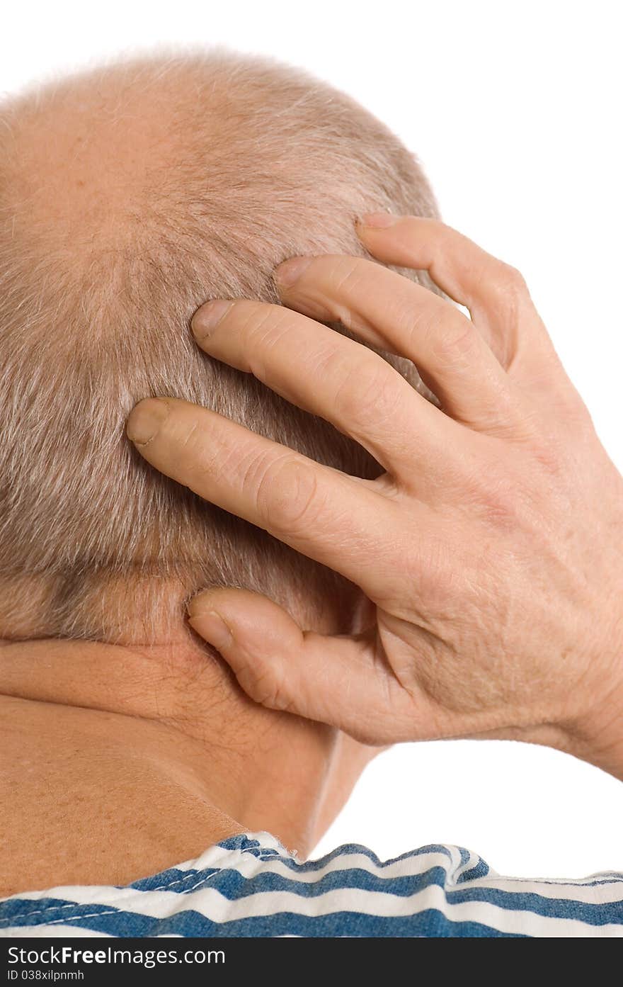 The elderly man scratches a nape on white